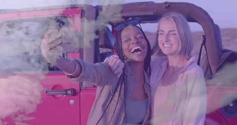 Friends Taking Selfie Beside Off-road Vehicle in Desert Adventure