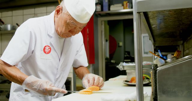 Experienced Sushi Chef Slicing Fresh Salmon in Restaurant Kitchen - Download Free Stock Images Pikwizard.com