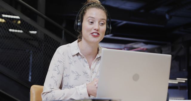 Young Woman Wearing Headphones Video Conferencing on Laptop - Download Free Stock Images Pikwizard.com