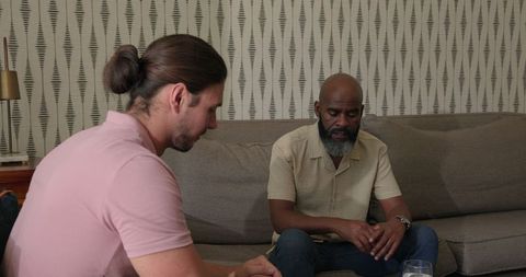 Two men contemplating conversation modern living room