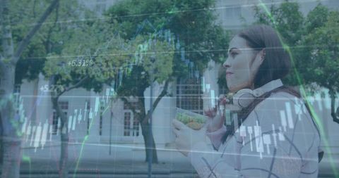 Woman eating salad analyzing digital market trends