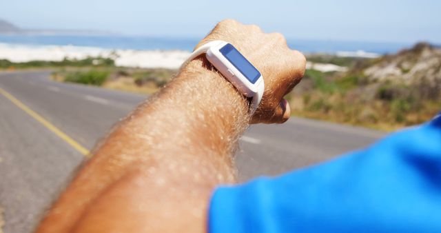 Athlete Checking Smartwatch for Fitness Tracking During Outdoor Run - Download Free Stock Images Pikwizard.com