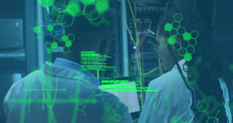 Engineers Programming in Server Room with Data Graphics