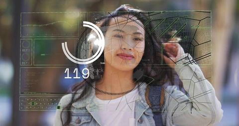 Young woman adjusting earbud with augmented reality hud overlay on campus walkway