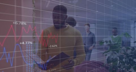 Businessman walks in modern office with digital financial graph overlay