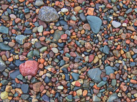 Colorful Pebbles Cover Rocky Beach Surface