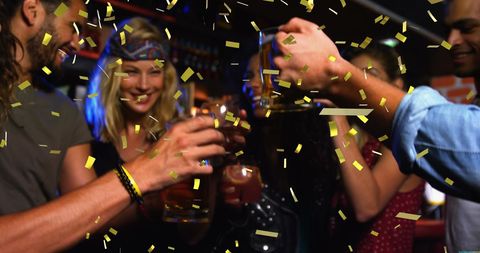 Joyful Celebration with Friends in Lively Bar Setting