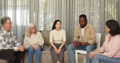 Diverse group therapy session promoting mental wellness