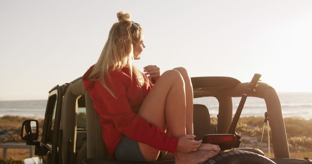 Young Woman Relaxing on Convertible Car at Sunset Near Beach - Download Free Stock Images Pikwizard.com