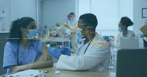 Medical professionals in clinic with digital data overlay