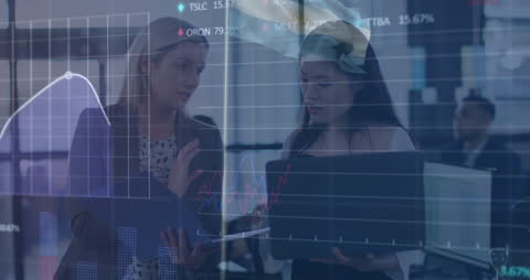 Diverse Female Colleagues Analyzing Market Data and Trends in Modern Office