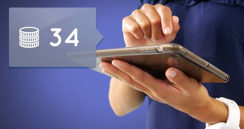 close-up of hands typing on tablet with digital coin tracker - Download Free Stock Images Pikwizard.com