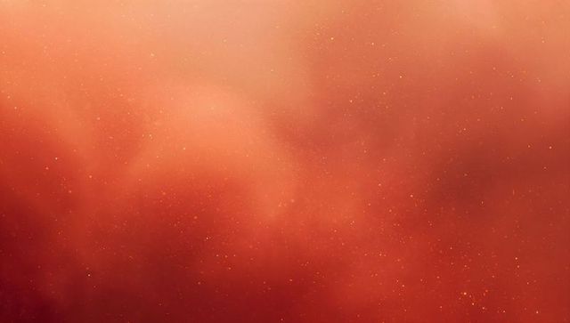 Glowing red-orange nebula with gold sparkles, shimmering cosmic gradient background