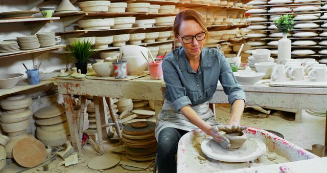 Woman Shaping Pottery on Wheel in Craft Studio - Download Free Stock Images Pikwizard.com
