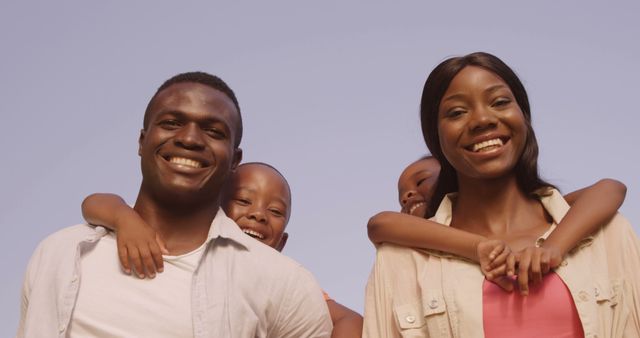 Happy African American Family Posing Outdoors Against Blue Sky - Download Free Stock Images Pikwizard.com