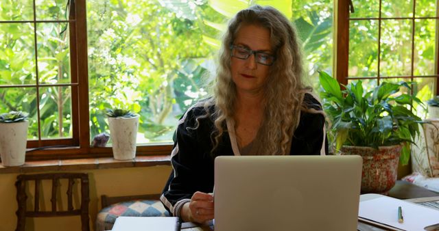 Senior Woman Working on Laptop in Bright Cozy Home Office - Download Free Stock Images Pikwizard.com