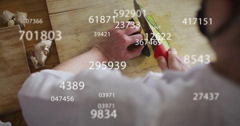Chef slicing vegetables with data overlays indicating smart culinary art