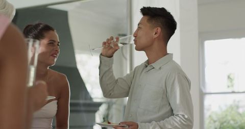 Guests enjoying conversation at elegant wedding reception indoors