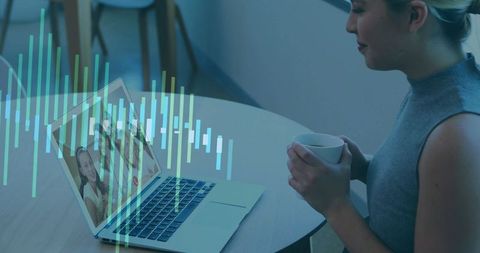 Woman Holding Mug Video Calling Family with Digital Overlay in Modern Home Office
