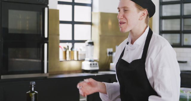 Young Female Chef Enjoying in Modern Kitchen - Download Free Stock Images Pikwizard.com