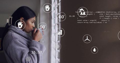 Morning ritual sipping mug by window with hud overlays for cozy smart home wellness serene