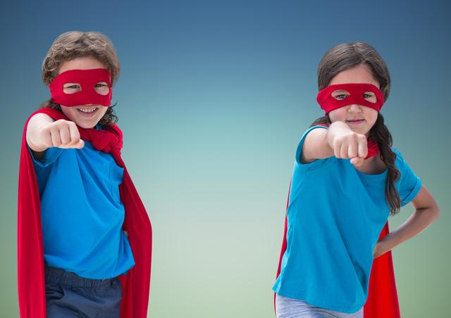 Digital composition of superhero kids in red capes and eye masks showing fists