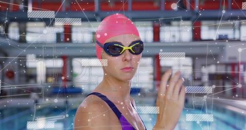Competitive Swimmer with Digital Interface in Modern Pool