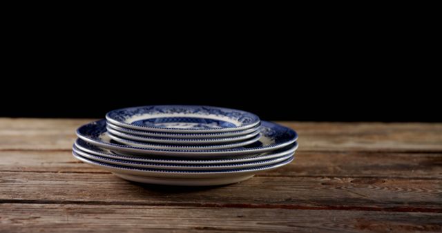 Stack of Elegant Blue and White Plates on Wooden Table - Download Free Stock Images Pikwizard.com