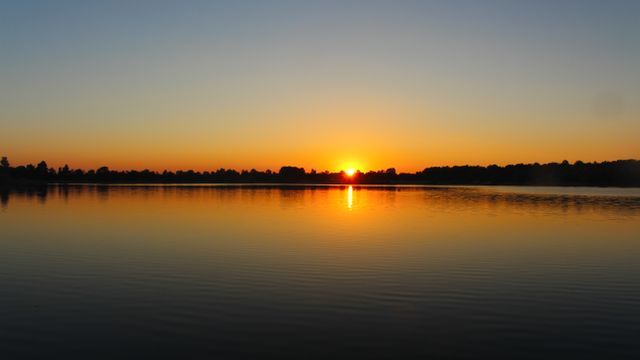 Peaceful Sunset Over Calm Lake Reflecting Vibrant Sky - Download Free Stock Photos Pikwizard.com