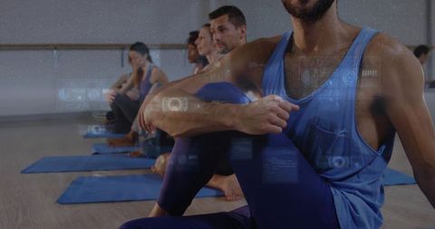 Group practicing yoga with augmented reality overlays and holographic fitness data