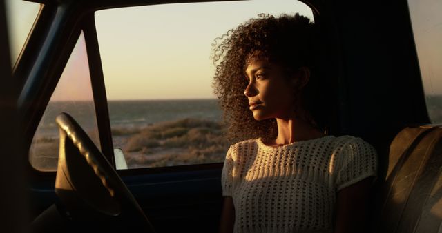 Pensive Person Sitting in Car at Sunset - Download Free Stock Images Pikwizard.com