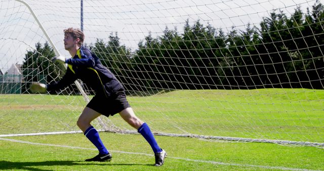 Goalkeeper in Action on Soccer Field - Download Free Stock Images Pikwizard.com