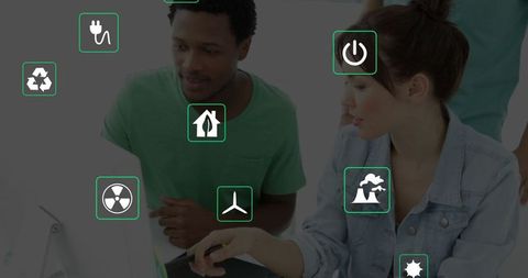 Team Collaborating with Green Energy Icons on Digital Screen