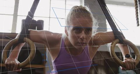 Female Athlete Intense Workout on Gymnastic Rings