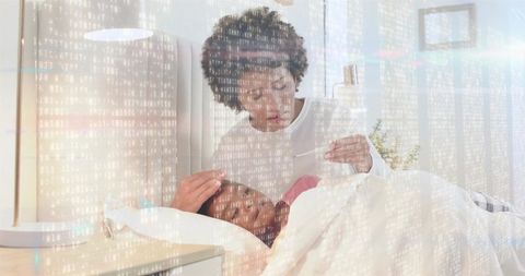 Checking fever at night with thermometer and comforting child with digital health overlay