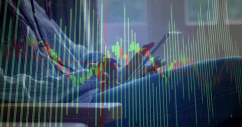 Woman Swiping Tablet Screen with Candlestick Graph Overlay