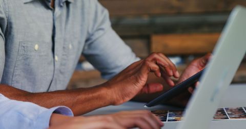 Business Professionals Collaborating with Tech Devices