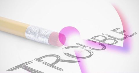 Erasing trouble with pink eraser on paper heart, yellow pencil close-up, magenta glow