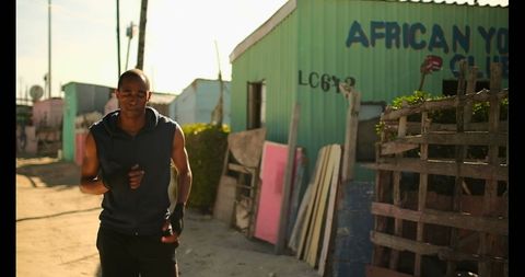Young Boxer Training Outdoors in Community Neighborhood