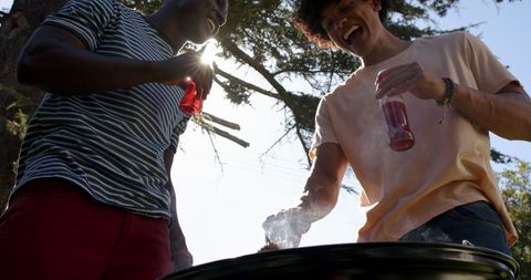 Young Friends Enjoy Barbecue Grilling and Outdoor Fun