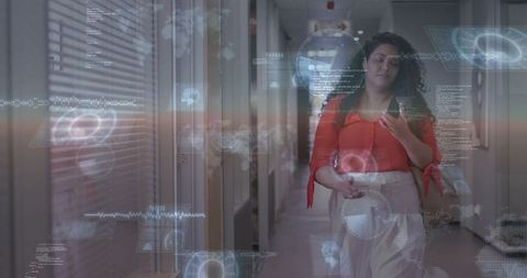 Businesswoman walking corridor interacting with futuristic augmented reality interface