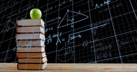 Books with Apple Against Math Equations Backdrop