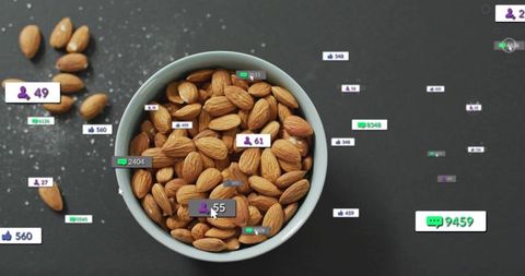 Floating social media icons over almond bowl in digital concept