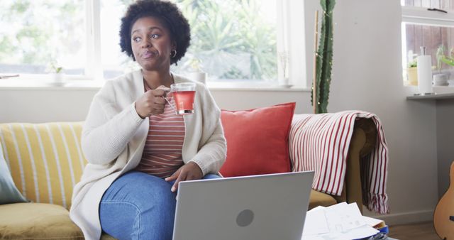 Relaxed Woman Drinking Tea While Working on Laptop at Home - Download Free Stock Images Pikwizard.com