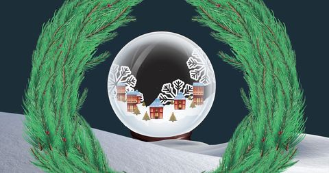 Festive snow globe with christmas village setting