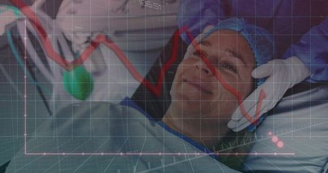 Patient in operating room with medical data visualization