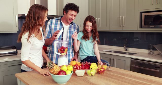 Family Enjoying Smoothie Making Together in Modern Kitchen - Download Free Stock Images Pikwizard.com