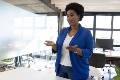 Professional leader engaging in corporate discussion in modern office