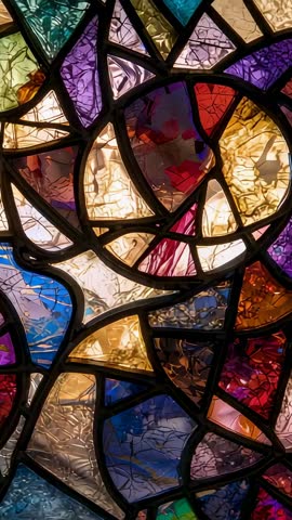 Vertical video panning stained glass window motif, colorful backlit mosaic with lead cames