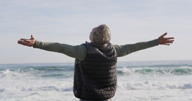 Elderly Man Embracing Ocean Breeze with Open Arms - Download Free Stock Images Pikwizard.com